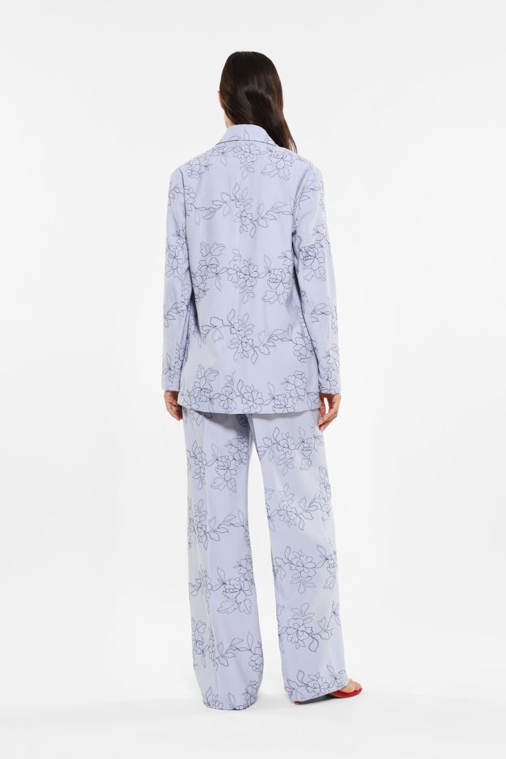 Pantaloni a palazzo fantasia floreale con piega stirata